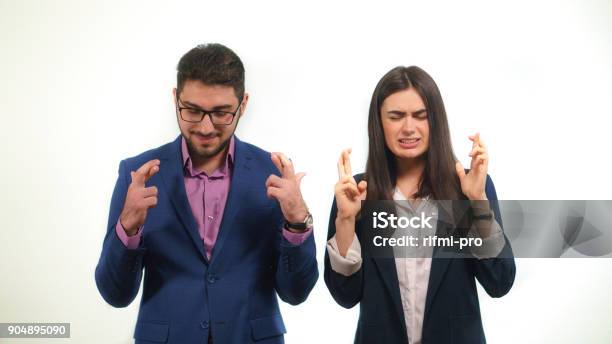 Office Staff Pray For The Success Of Their Chief In Elections Supporting Him In This Way Stock Photo - Download Image Now