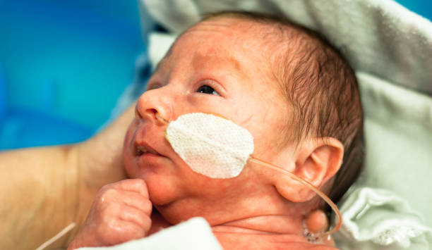 istock Premature baby with a nasal feeding tube getting a bath 904895204