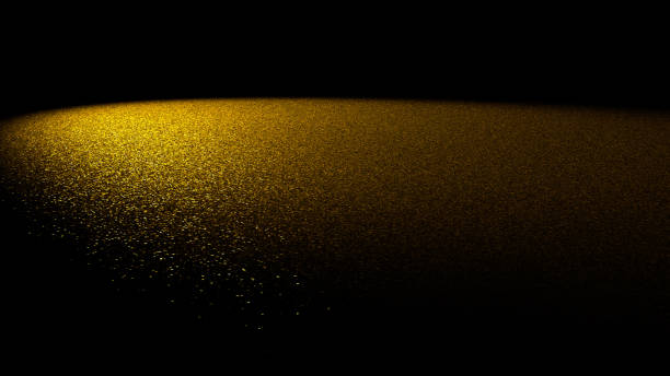 istock twinkling glitter background - golden glitter on a flat surface lit by a spotlight 904906170
