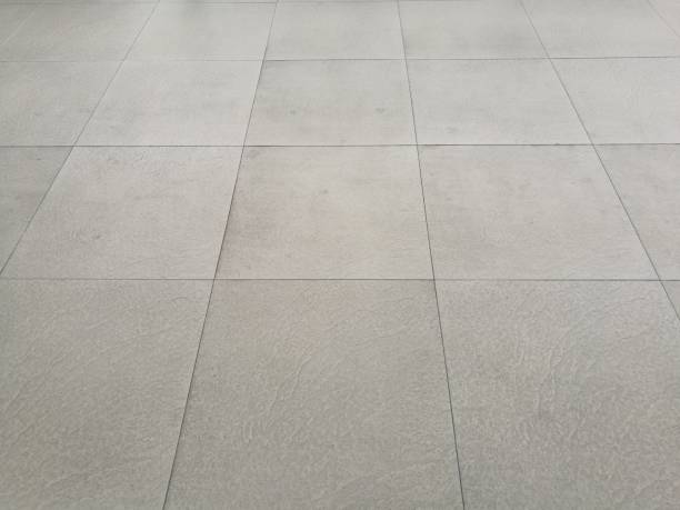 istock White floor pathway paved with tiles in perspective view. 904910272