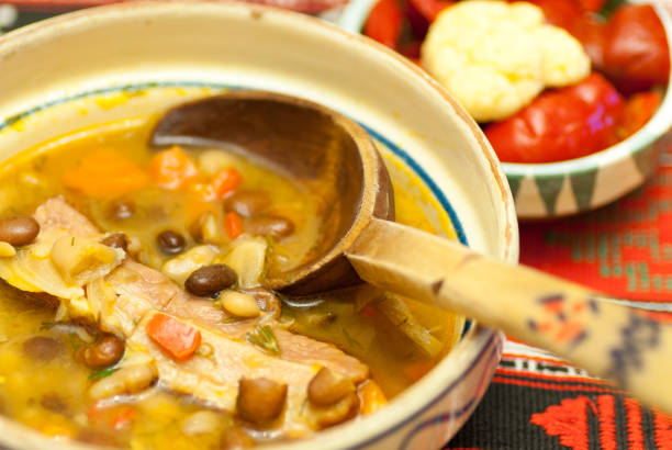 istock bowl with delicious bean soup with smoked meat and assorted pickles aside 904922574