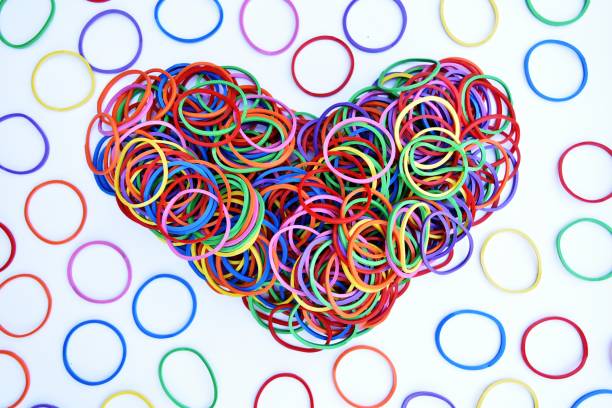 istock heart shape of colorful rubber ring on white paper background 904923106