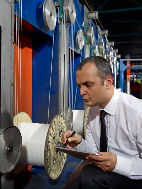 istock Businessman in factory 904925990