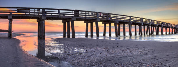 istock Naples Pier on the beach at sunset 904928710