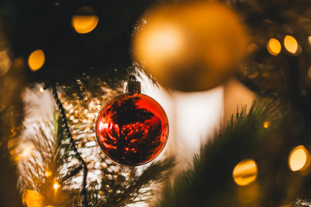 istock Red Christmas Ornaments on a Christmas tree 904932918