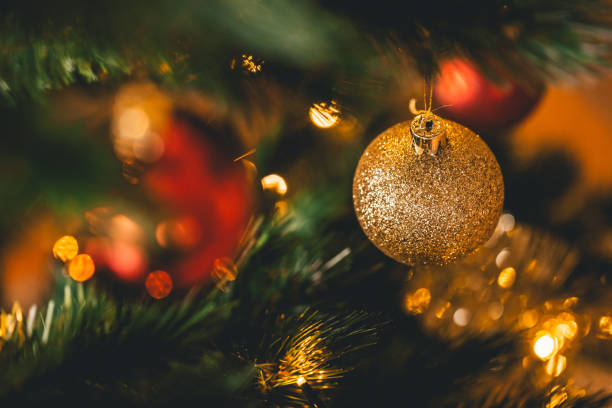 istock Golden Christmas Ornaments on a Christmas tree 904933028