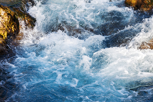 Close up of waterfall flowing over rocks into freshwater. Photographed in Tropical North Queensland, Australia.