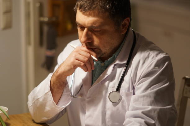 istock Doctor writing prescription at his desk 904937328