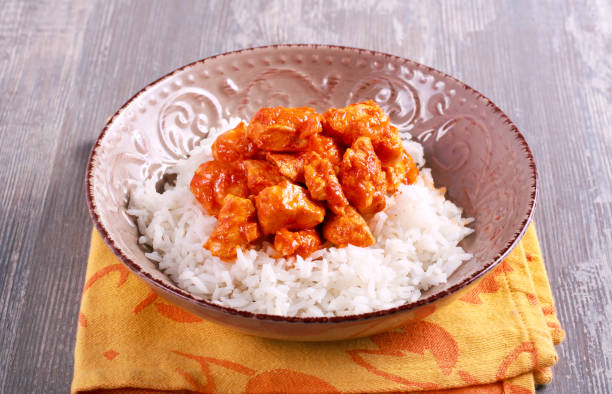 istock Chicken fillet in tomato sauce and rice 904943658