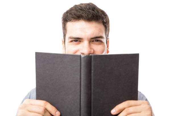istock Happy man enjoying a good book 904947304