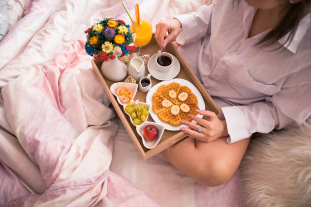 istock Woman having healthy breakfast on bed 904947760