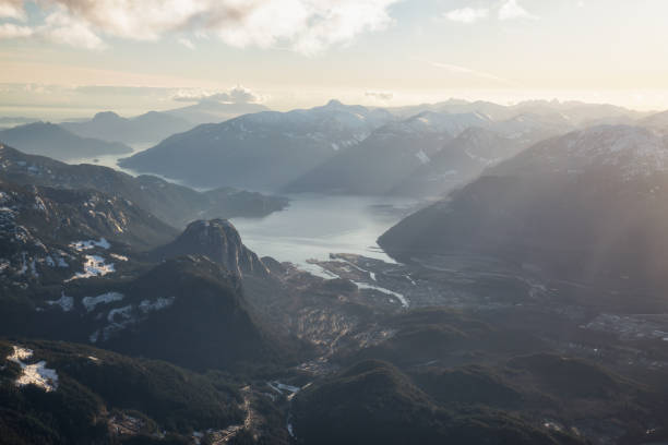 Aerial view of Squamish City, BC, Canada, during a winter sunset.