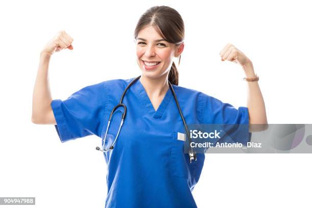 Female Doctor Acting As Superhero Stock Photo - Download Image Now - Nurse, Strength, Superhero