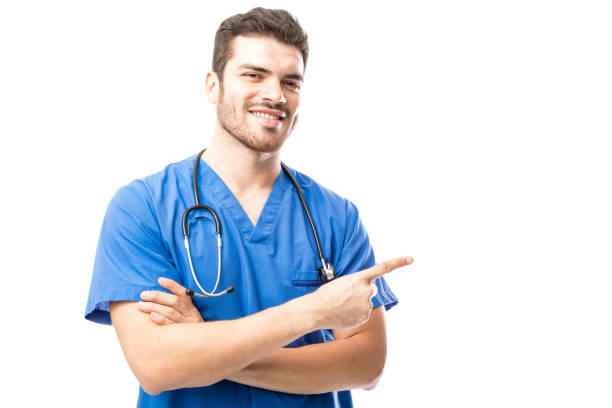 istock Male doctor pointing to copy space 904950472