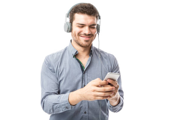 istock Attractive man listening to music 904950804