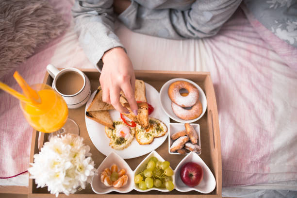 istock Breakfast in bed, tray with a meal and coffee 904957532