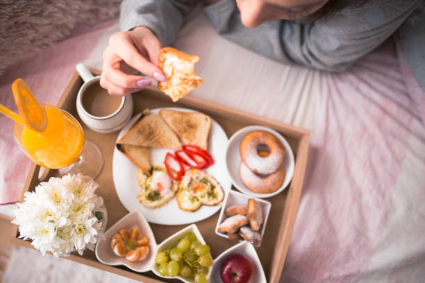 istock Breakfast in bed, tray with a meal and coffee 904957626