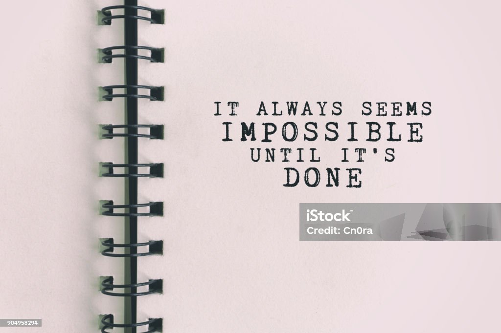 Inspirational Quote About Success Inspirational Quote - It always seems impossible until it's done. Blurry retro background. Motivation Stock Photo