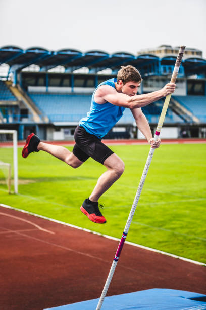 istock Male athlete unsuccessful attempt in pole vault competition 904960584