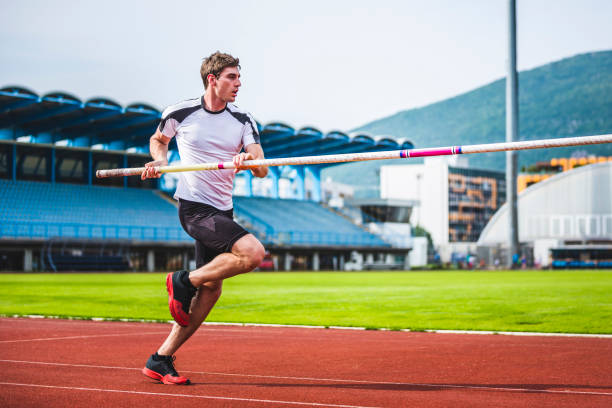 istock Male athlete during pole vault run 904961104