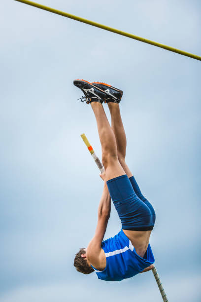 istock Male athlete in pole vault competition 904961878