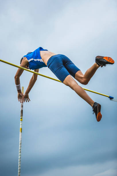 istock Pole vault man athlete attempt over bar 904964074