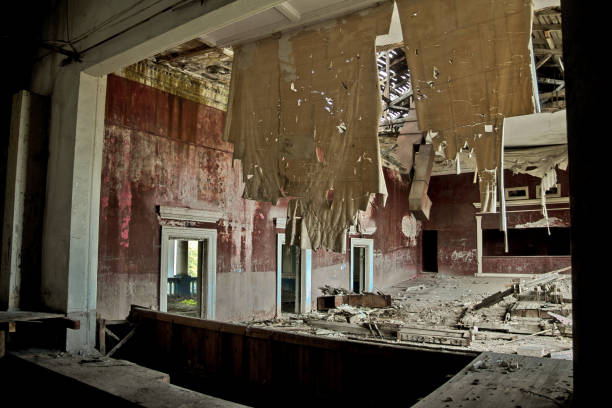 istock Old abandoned rotten ruined theater, a ragged curtain 904968608