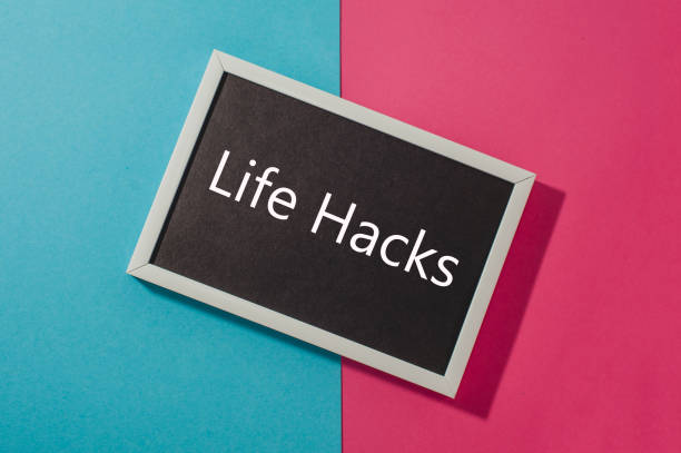 istock Life hacks - text on chalkboard on blue and pink bright background. 904975056