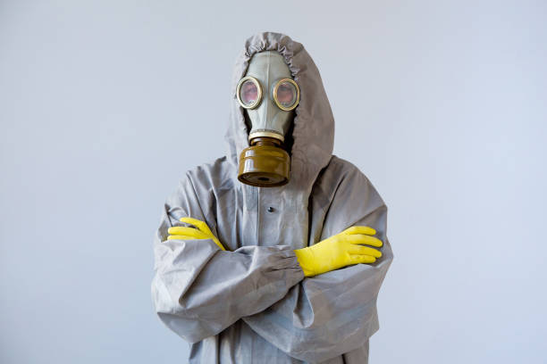 istock People in gas masks 904992088