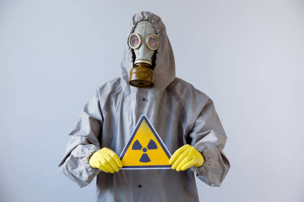 istock People in gas masks 904992320