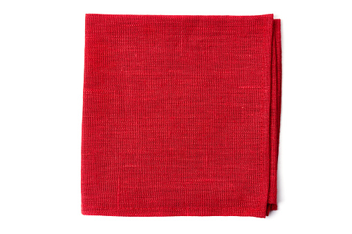 Red textile napkin isolated on white background