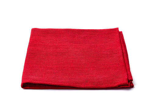 Red textile napkin isolated on white background