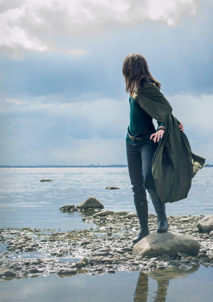 istock Woman on sea shore 905001280