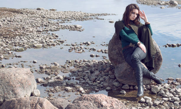 istock Woman on sea shore 905001332