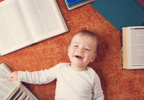 istock One year old baby with spectackles and books 905007554