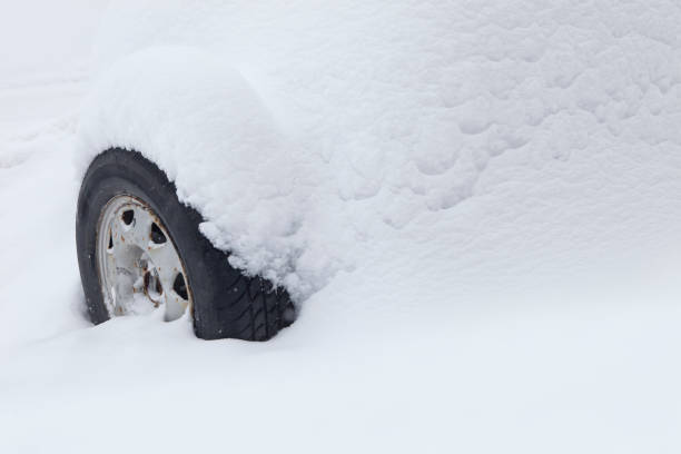 istock Old Car Tire Under the Snow 905008012