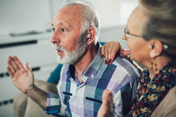 istock Older man and woman or pensioners with a hearing problem 905011072