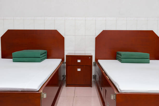 istock neat and tidy beds with square folded quilts for soldiers 905014832