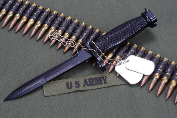 istock bayonet and ammunition belt on US ARMY uniform background 905018466