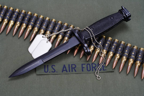 istock bayonet and ammunition belt on US AIR FORCE uniform background 905019096