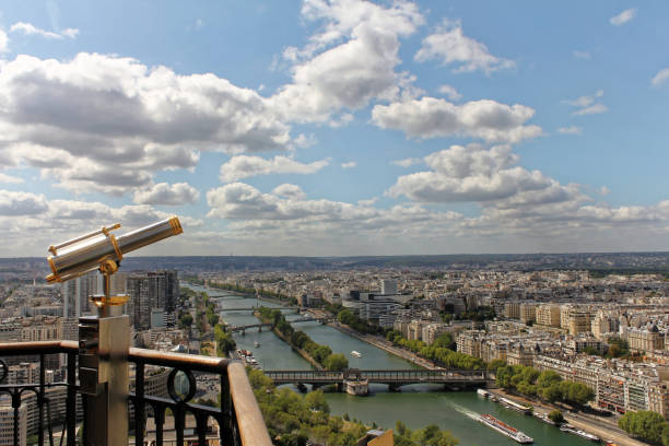 istock Monocular telescope at Eiffel Tower in Paris and view over the city. 905021566