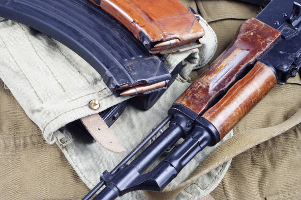 istock AK 47 on USSR Soviet Army khaki uniform background 905021646