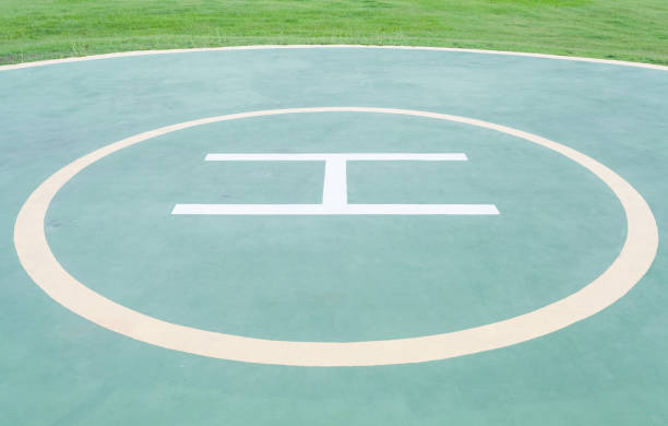 istock Close - up empty helipad and green grass 905024066