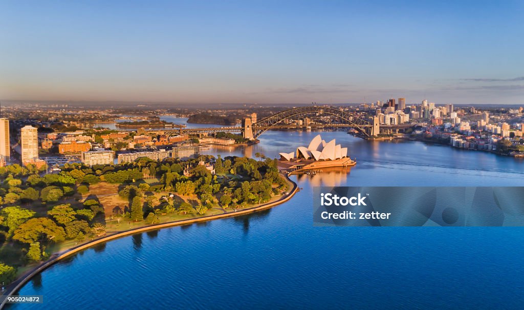 D RBG Op 2 North Sydney Sydey harbour blue waters and waterfront of Sydney city CBD between Circular quay and NOrth Sydney shores connected by the Sydney harbour bridge in aerial view. Sydney Stock Photo