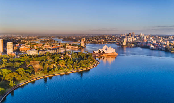 D RBG Op 2 North Sydney Sydey harbour blue waters and waterfront of Sydney city CBD between Circular quay and NOrth Sydney shores connected by the Sydney harbour bridge in aerial view. sydney harbor photos stock pictures, royalty-free photos & images