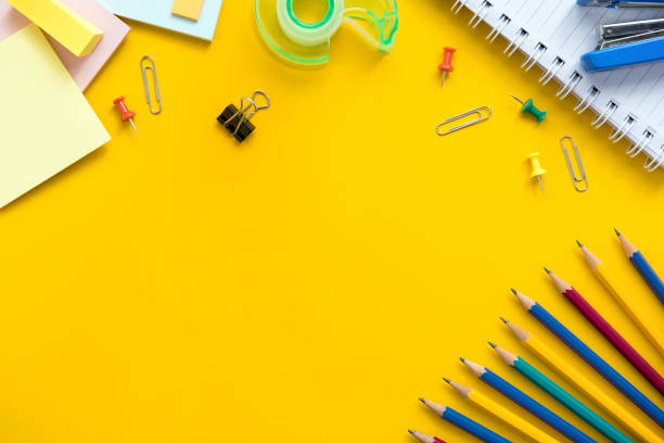 istock Colorful stationery on yellow background 905028970