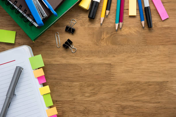 istock Colorful stationery on wooden table background 905028972