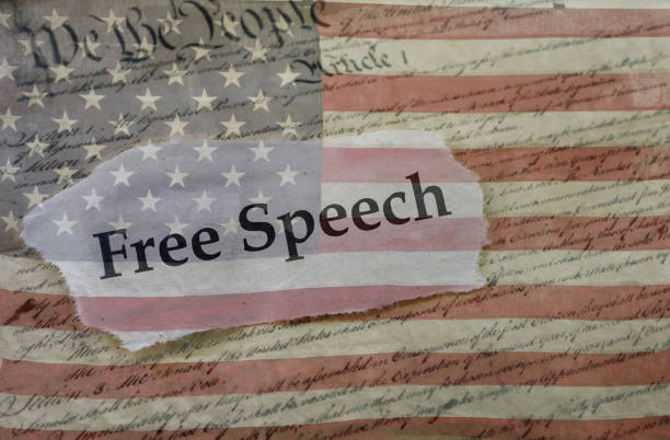 Free Speech, Constitution and flag Free Speech news headline on a copy of the  United States Constitution and the US flag censorship photos stock pictures, royalty-free photos & images