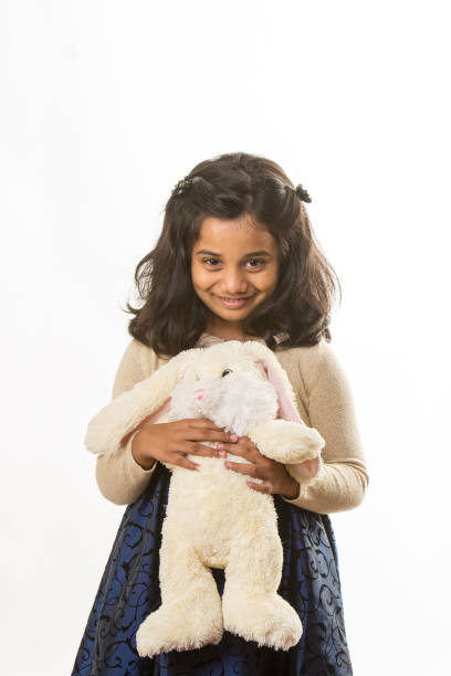 istock Smiling Indian Girl with Bunny 905044952
