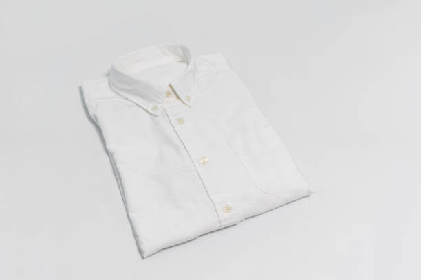 istock Folded white shirt with pocket isolated on white background 905045690